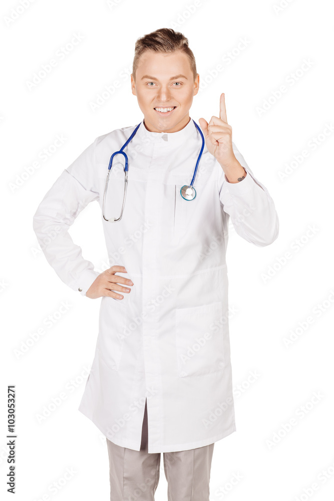Young male doctor in white coat and stethoscope finger point up Young male doctor in white coat and stethoscope finger point up