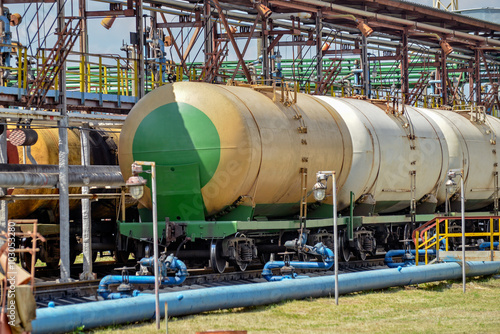 Old fuel tanks at the railway station on a bright sunny summer day