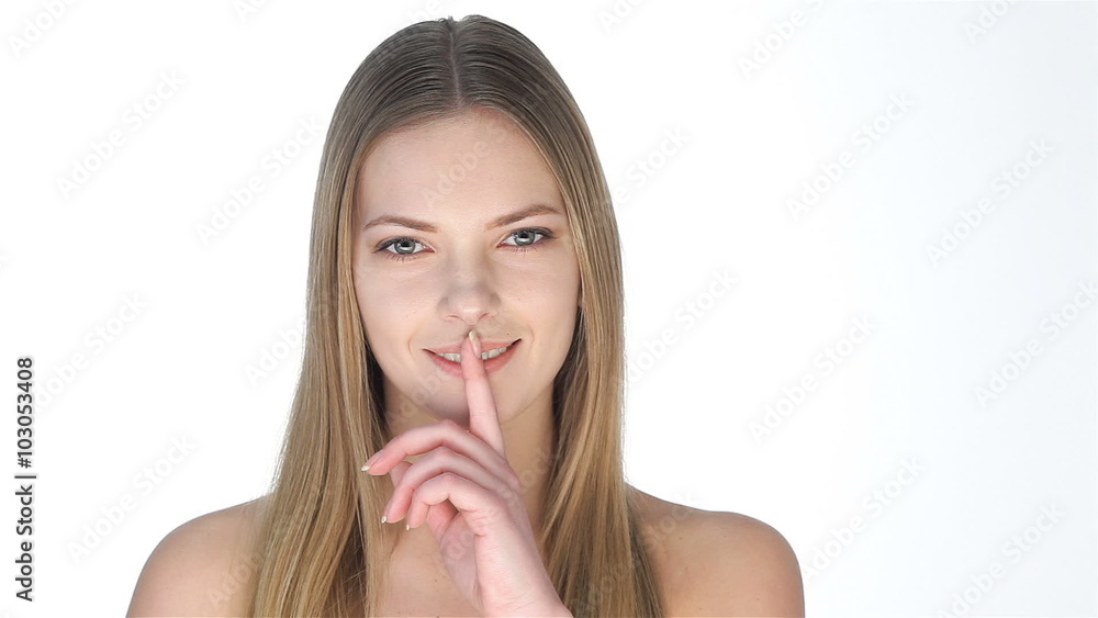Beautiful blonde doing shh gesture Beautiful blonde doing shh gesture