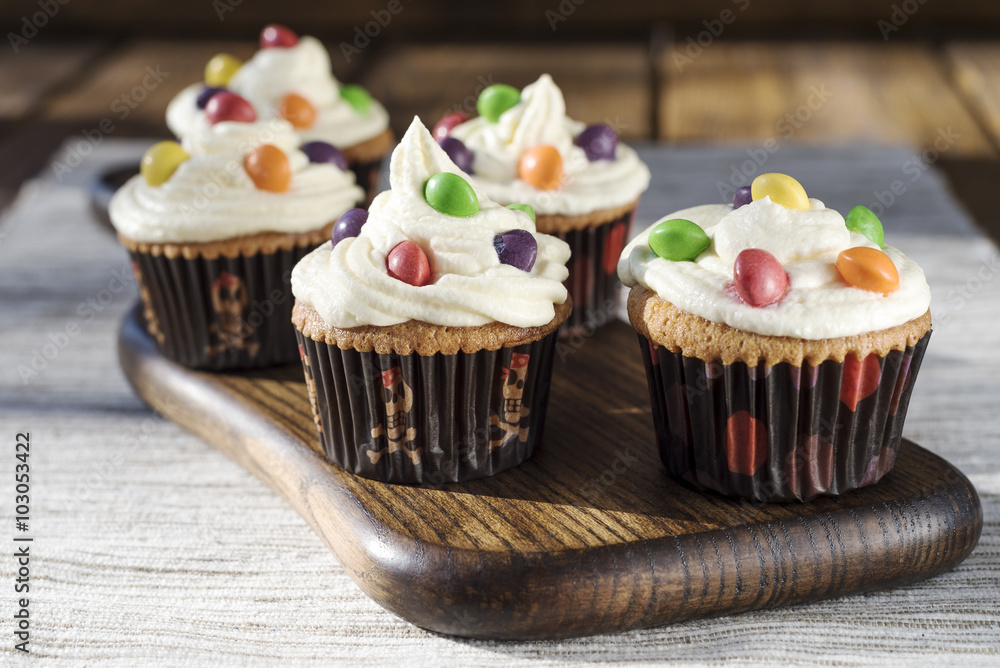 Creamy cupcakes with color drops