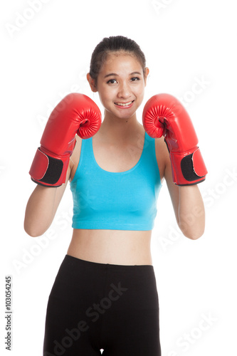 Beautiful healthy Asian girl with red boxing glove