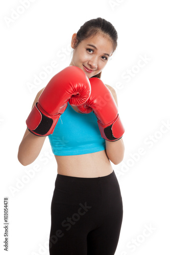 Beautiful healthy Asian girl with red boxing glove