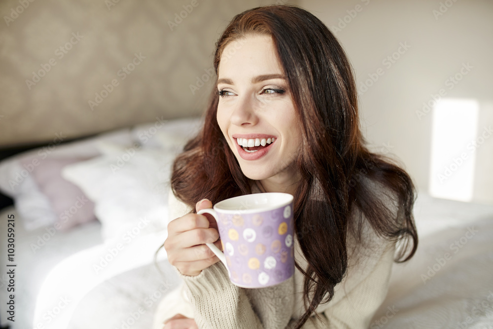 woman with a cup of coffee in the morning in the bedroom woman with a cup of coffee in the morning in the bedroom