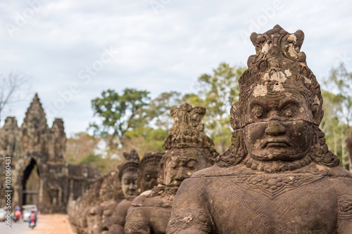 Statue at gate of Angkor Thom , Siem Reap , Cambodia