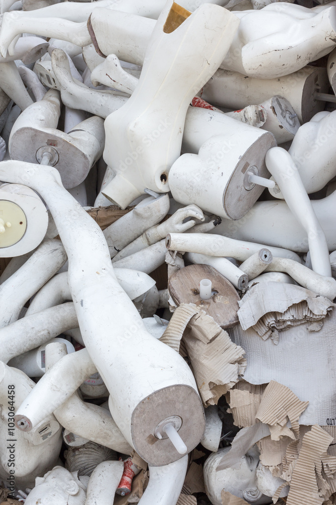 A pile of abandoned old mannequins