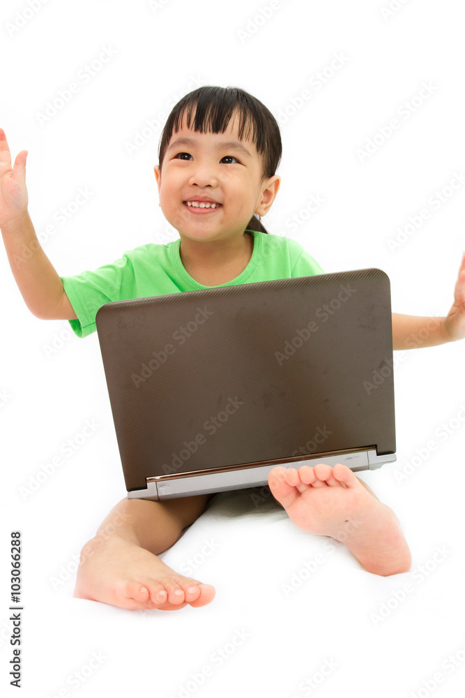 Chinese little girl sitting on floor with laptop Chinese little girl sitting on floor with laptop