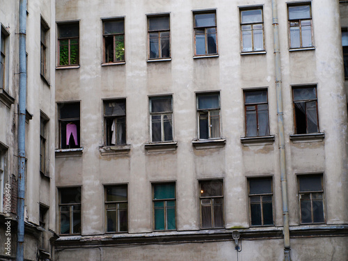 Old high-rise building with windows in Saint-Petersburg