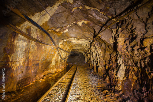 Underground abandoned gold mine ore tuneel with rails Berezovsky mine Ural