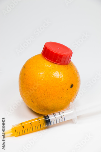 A real orange fruit was sucked with syringe