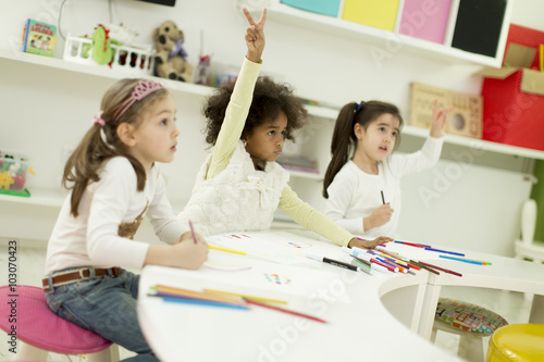 Multiracial children drawing in the playroom © BGStock72