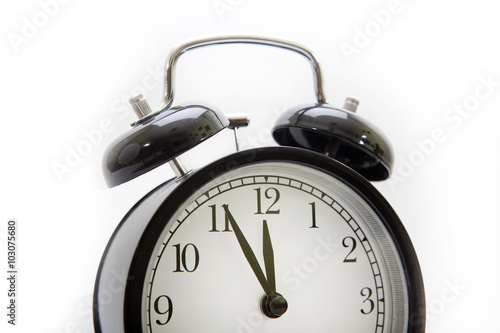 Vintage alarm clock on a white background