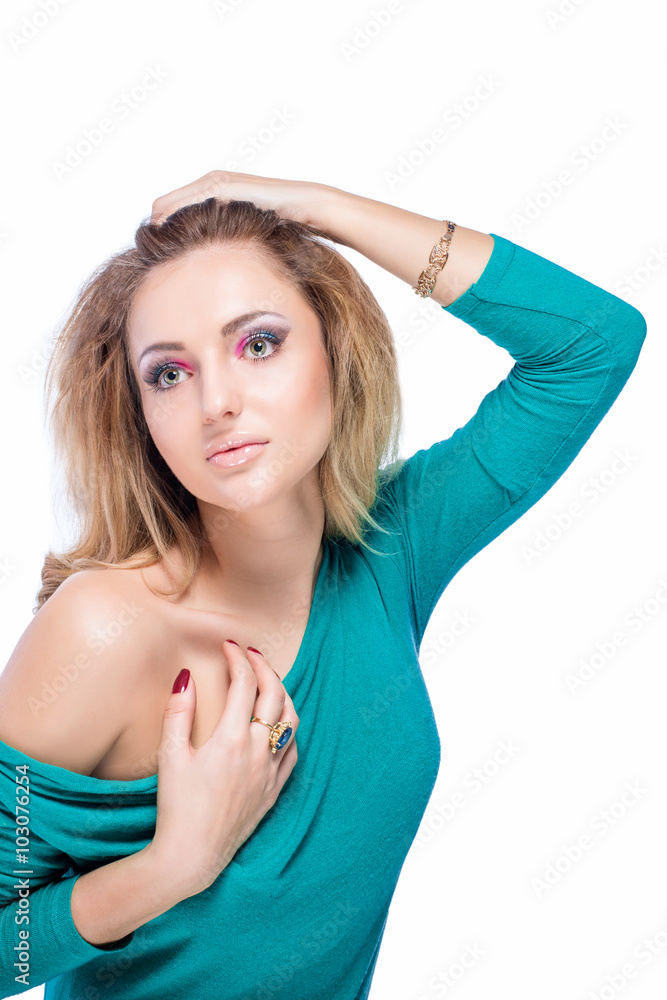 Beautiful blonde girl with bright makeup, long curled hair and massive jewelry isolated on white background. Fashion shot. Beautiful blonde girl with bright makeup, long curled hair and massive jewelry isolated on white background. Fashion shot.