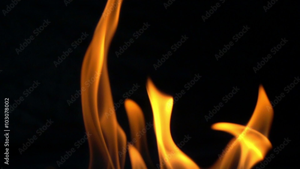 Fire flames in slow motion on black background