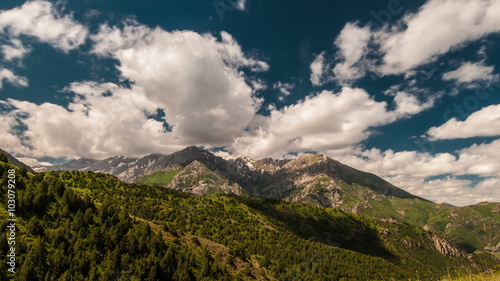 4K Timelapse. Beautiful clouds high in mountains Sairam-Su, Tyan-Shan, Kazahkstan photo