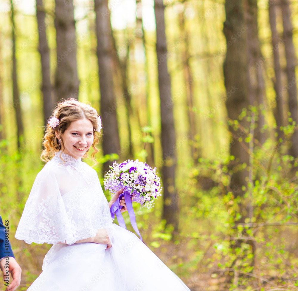 Beautiful bride with bouquet of flowers outdoor Beautiful bride with bouquet of flowers outdoor