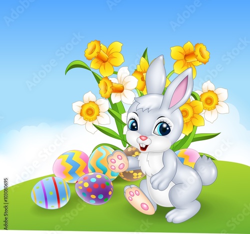 Cartoon happy bunny with colourful Easter eggs
