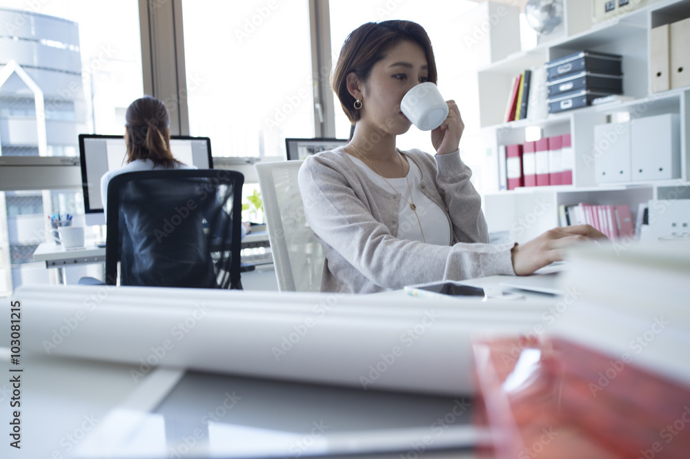 Women have to work with a cup of coffee Women have to work with a cup of coffee
