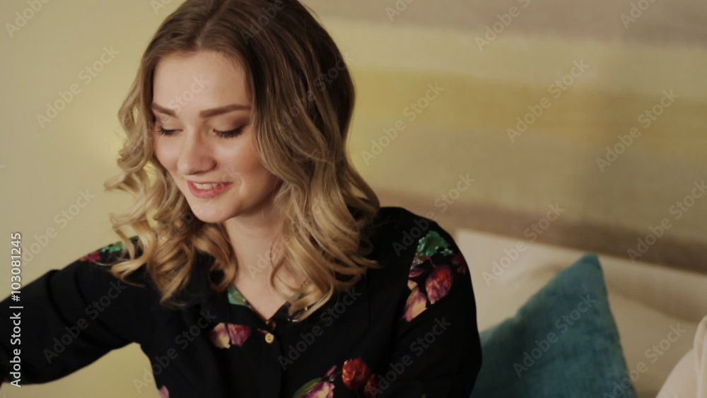 beautiful girl sitting on the couch and folded underwear in bags beautiful girl sitting on the couch and folded underwear in bags