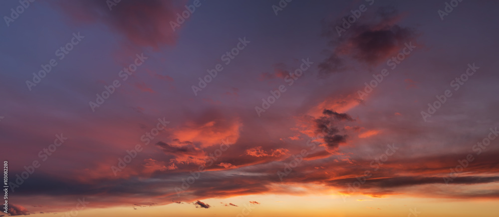 Beautiful sunset sky with dark-red clouds. Hi-res panorama.