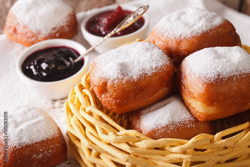 New Orleans beynet donuts in a basket macro. horizontal
