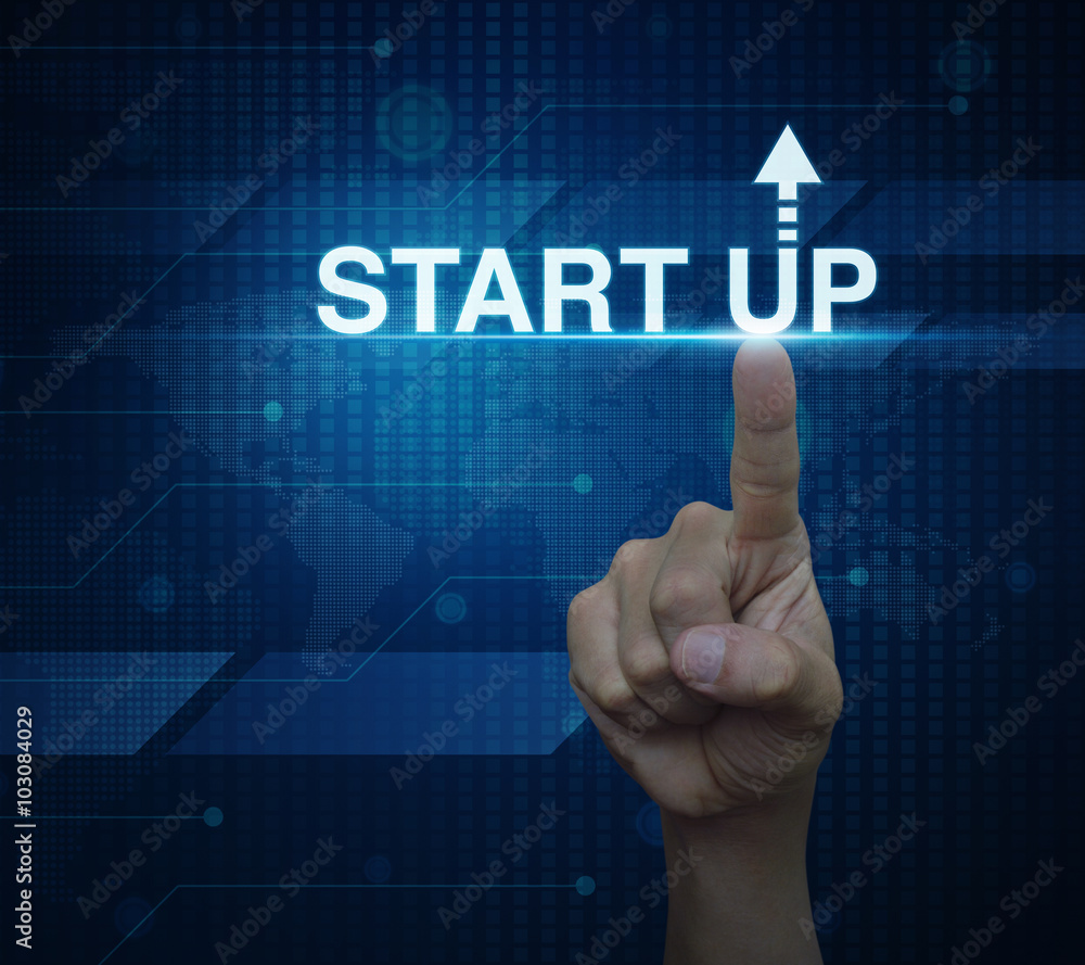 Hand click on start up icon over digital world map technology st Hand click on start up icon over digital world map technology st