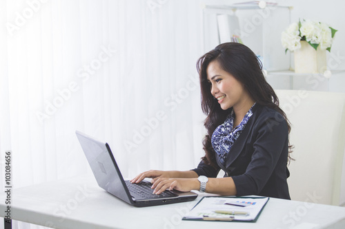 business woman using laptop © Odua Images