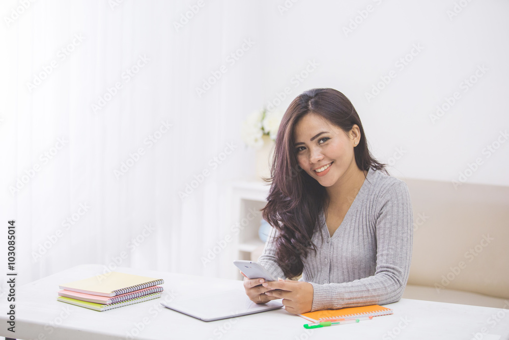 asian woman in casual using mobile phone asian woman in casual using mobile phone
