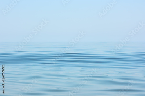 Calm sea surface. Seascape in early morning hours under clear skies. photo