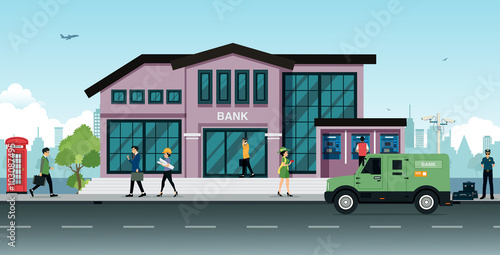 Vehicles parked in front of the bank with the city as a backdrop.