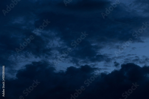 black cloud in dark night sky background © sutichak