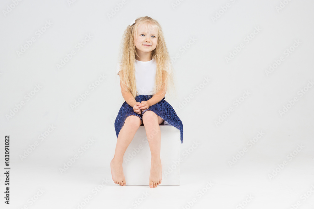 Cute blonde little girl in blue skirt Cute blonde little girl in blue skirt