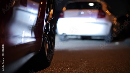 Shot of a wheel while driving a sports car at night.