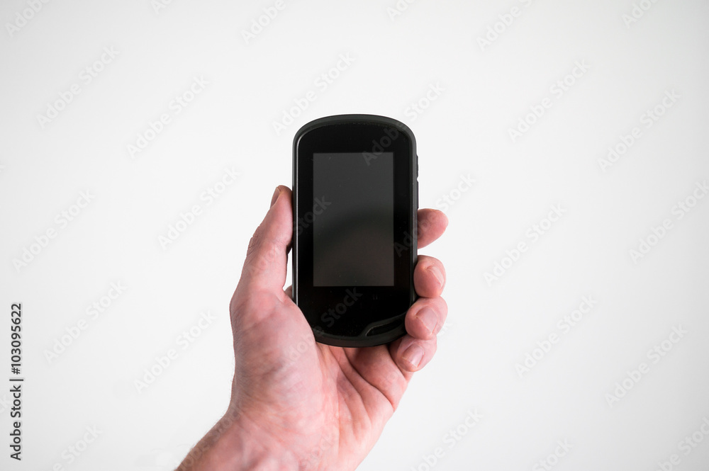 A man holds a navigator in hand on a white background A man holds a navigator in hand on a white background