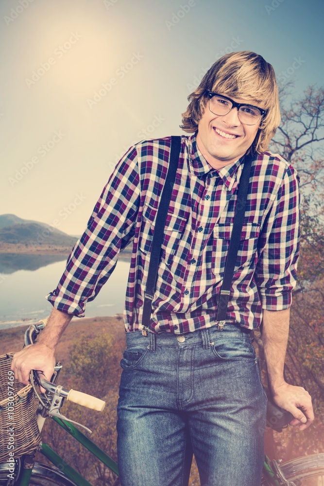 Composite image of portrait of smiling blond hipster Composite image of portrait of smiling blond hipster