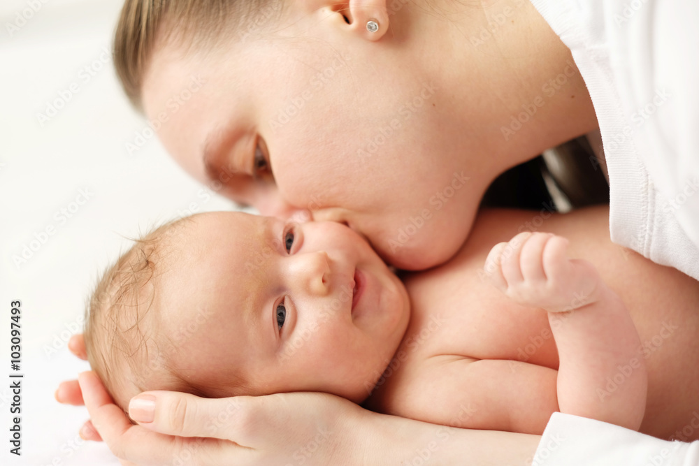 One month old newborn baby with mother