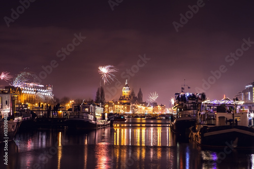 Photography AMSTERDAM, NETHERLANDS - JANUARY 1, 2016: Festive salute of fireworks on New Year's night