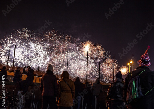 AMSTERDAM, NETHERLANDS - JANUARY 1, 2016: Festive salute of fireworks on New Year's night. On January 1, 2016 in Amsterdam - Netherland. photo