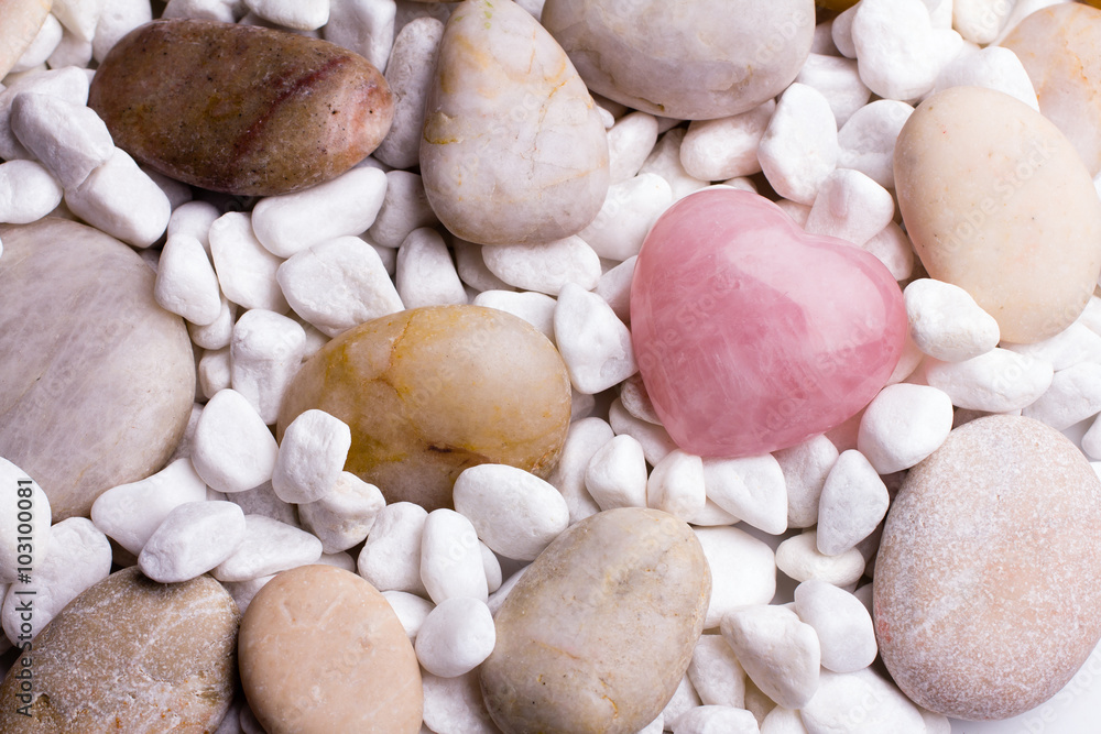 Pink heart stone on the spa stone background. Pink heart stone on the spa stone background.