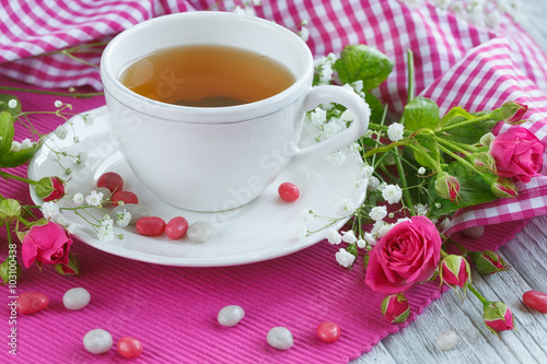 Cup of tea and roses