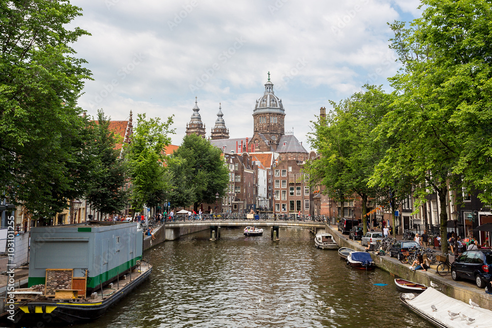 Naklejka premium Canal and St. Nicolas Church in Amsterdam