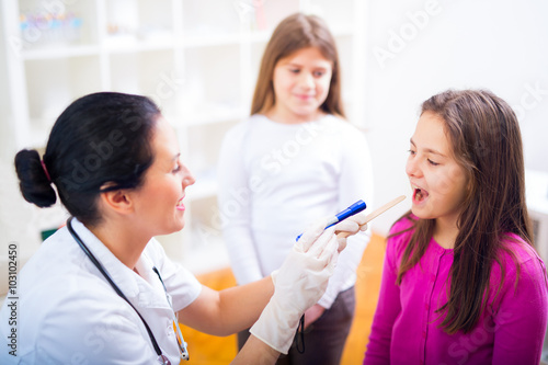 Female doctor and patient teenagers.Medical examination.