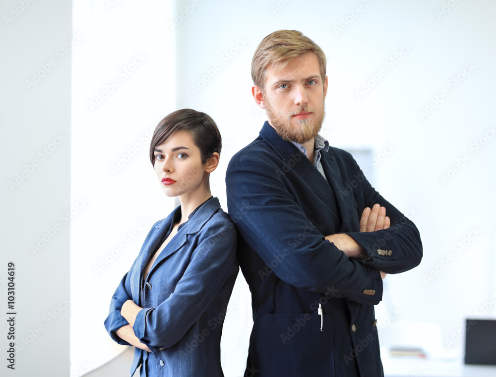 Businessman and businesswoman standing back to back with crossed Businessman and businesswoman standing back to back with crossed