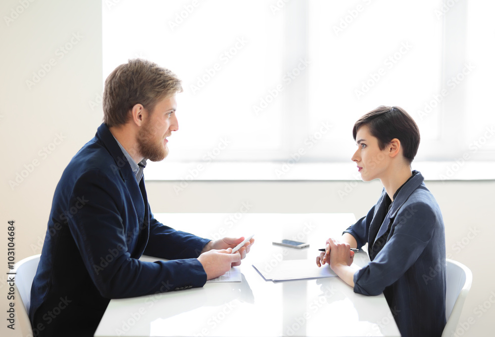 Businessman and businesswoman having interview Businessman and businesswoman having interview