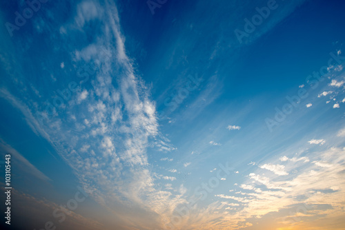 Evening sky with clouds and sun photo