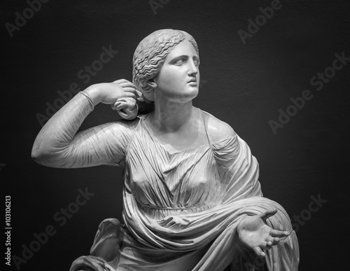 White marble statue of young woman
