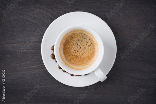 Coffee cup top view on wooden table background