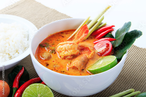 Thai Prawn Soup with Lemongrass (Tom Yum Goong) with Rice On Brown Cloth Background.