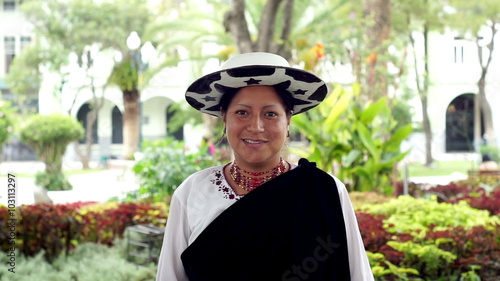 Portrait shot of an indigenous Saraguro woman wearing traditional dress in the province of Loja and the country of Ecuador.