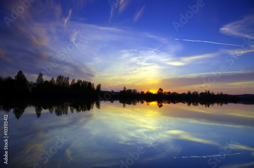 Dramatic evening sky over lake  tranquil nature scene