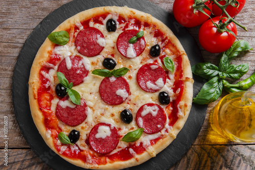 pizza with salami tomato and cheese